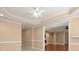 Open living space boasts decorative ceiling, paint and view into dining area at 10565 Highgate Manor Ct, Duluth, GA 30097