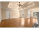 Large living room featuring hardwood floors, neutral paint, and plenty of natural light at 10565 Highgate Manor Ct, Duluth, GA 30097