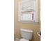 Close up of toilet next to window with blinds in bathroom at 10565 Highgate Manor Ct, Duluth, GA 30097