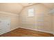 Bright walk-in closet features custom shelving and hardwood floors at 10565 Highgate Manor Ct, Duluth, GA 30097