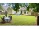 Well-maintained backyard with a dining set and patio seating for outdoor entertaining at 159 Misty Ridge Trl, Stockbridge, GA 30281