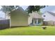 Spacious backyard with a fenced perimeter and patio seating, perfect for relaxation at 159 Misty Ridge Trl, Stockbridge, GA 30281