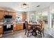 Bright kitchen with light wood cabinets, stainless appliances, and a breakfast nook at 159 Misty Ridge Trl, Stockbridge, GA 30281