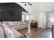 Vaulted ceilings and hardwood floors accent this stylish living room with modern decor at 159 Misty Ridge Trl, Stockbridge, GA 30281