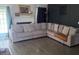 Spacious living room with a cozy sectional sofa, fireplace, and hardwood flooring at 159 Misty Ridge Trl, Stockbridge, GA 30281
