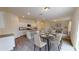 Open-concept kitchen and dining area featuring granite counters, stainless steel appliances, and hardwood floors at 337 Torcello Blvd, Mcdonough, GA 30253