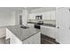 Modern kitchen featuring granite countertops, white cabinets, stainless steel appliances, and hardwood floors at 337 Torcello Blvd, Mcdonough, GA 30253