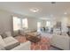 Bright and airy living room featuring an open floor plan, neutral colors, and a large window at 337 Torcello Blvd, Mcdonough, GA 30253