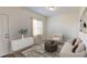 Cozy living room featuring natural light and neutral colors, with a door to the outside at 337 Torcello Blvd, Mcdonough, GA 30253
