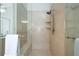 Modern bathroom featuring a glass enclosed shower with a built in bench and sleek fixtures at 6105 Overlook Park Dr, Cumming, GA 30040