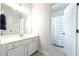 Bright bathroom featuring a white vanity and a separate shower room at 6105 Overlook Park Dr, Cumming, GA 30040