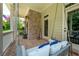 Inviting front porch with brick accents featuring a brick floor and relaxing porch swing at 6105 Overlook Park Dr, Cumming, GA 30040