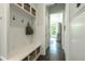 Hallway with bench, beadboard, and access to other rooms at 6105 Overlook Park Dr, Cumming, GA 30040