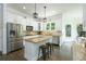 Bright kitchen with white cabinets, granite countertops, stainless steel appliances, and a central island at 6105 Overlook Park Dr, Cumming, GA 30040