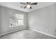 Bedroom featuring light gray walls, light gray flooring, and a window with blinds at 6947 Gallant Se Cir # 10, Mableton, GA 30126