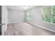 A bedroom with light gray walls, a ceiling fan and light gray flooring at 6947 Gallant Se Cir # 10, Mableton, GA 30126