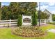 A flower bed sits at the base of the Parkview Commons community sign at 6947 Gallant Se Cir # 10, Mableton, GA 30126