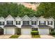 Charming townhouse featuring black shutters, single car garage and manicured lawn at 6947 Gallant Se Cir # 10, Mableton, GA 30126