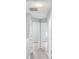 A hallway with gray walls, light gray flooring, and white doors at 6947 Gallant Se Cir # 10, Mableton, GA 30126