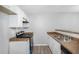 Galley-style kitchen featuring white cabinets and granite countertops at 6947 Gallant Se Cir # 10, Mableton, GA 30126