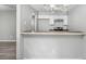 An eat-in kitchen with white cabinets and brown countertops opens to the adjacent space at 6947 Gallant Se Cir # 10, Mableton, GA 30126