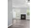 Cozy living room with fireplace and access to the outdoor patio at 6947 Gallant Se Cir # 10, Mableton, GA 30126
