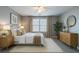 Cozy bedroom with soft lighting, stylish decor, and a relaxing ambiance at 7432 Battlecreek Ln, Jonesboro, GA 30236