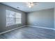 A spacious bedroom is enhanced by ample sunlight streaming through a large window at 7432 Battlecreek Ln, Jonesboro, GA 30236