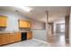 Practical kitchen area featuring wood cabinetry and essential appliances at 7432 Battlecreek Ln, Jonesboro, GA 30236