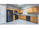 Functional kitchen featuring wood cabinets and modern appliances at 7432 Battlecreek Ln, Jonesboro, GA 30236