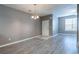Well-lit living room showcasing neutral walls, modern flooring, and natural light at 7432 Battlecreek Ln, Jonesboro, GA 30236