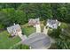 An aerial view shows the property nestled in a cul-de-sac surrounded by lush greenery at 206 Five Iron Nw Ct, Kennesaw, GA 30144