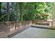 Picturesque backyard deck featuring a charming pergola and ample space, set amidst lush greenery at 206 Five Iron Nw Ct, Kennesaw, GA 30144