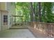 Expansive backyard deck provides tranquil outdoor living space with a charming pergola and lush landscaping at 206 Five Iron Nw Ct, Kennesaw, GA 30144