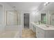 This bathroom offers a separate shower and tub, double sinks, and neutral paint at 206 Five Iron Nw Ct, Kennesaw, GA 30144