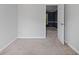 The bedroom features neutral paint and carpet, with an open door at 206 Five Iron Nw Ct, Kennesaw, GA 30144