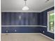 The formal dining room features chair rail, blue striped walls and new carpet at 206 Five Iron Nw Ct, Kennesaw, GA 30144