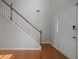 Bright entryway featuring hardwood floors, a staircase, and a white front door at 206 Five Iron Nw Ct, Kennesaw, GA 30144