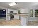 Clean kitchen with stainless steel appliances, tile floors, and granite countertops at 206 Five Iron Nw Ct, Kennesaw, GA 30144