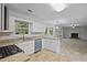 Well-lit kitchen features granite countertops, stainless steel appliances, and a gas stove at 206 Five Iron Nw Ct, Kennesaw, GA 30144