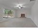 Spacious living room features a fireplace and large windows overlooking the backyard at 206 Five Iron Nw Ct, Kennesaw, GA 30144