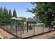 Community playground offers a fun and safe outdoor recreation area for children within a secure fenced perimeter at 206 Five Iron Nw Ct, Kennesaw, GA 30144