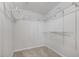 Bright walk-in closet features a spacious design and adjustable metal shelving for versatile storage options at 206 Five Iron Nw Ct, Kennesaw, GA 30144