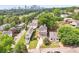 Panoramic aerial view of a neighborhood showcasing a home with covered porches, a two-car garage, and lush greenery at 218 South Se Ave, Atlanta, GA 30315