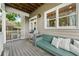 Relaxing back porch featuring an outdoor grill and comfortable bench with pillows at 218 South Se Ave, Atlanta, GA 30315