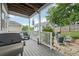 Outdoor living on a cozy back porch, with an outdoor grill, bench seating, and backyard view at 218 South Se Ave, Atlanta, GA 30315