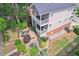 Aerial view of a backyard with tiered gardens, a stone patio, and a multi-level porch perfect for outdoor gatherings at 218 South Se Ave, Atlanta, GA 30315