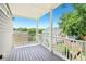 Relaxing outdoor balcony offers fresh air and neighborhood views framed by trees and blue sky at 218 South Se Ave, Atlanta, GA 30315