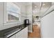 Modern bar area with granite countertop and wine refrigerator at 218 South Se Ave, Atlanta, GA 30315