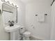 Bathroom with square mirror, matte black plumbing fixtures and towel bar at 218 South Se Ave, Atlanta, GA 30315